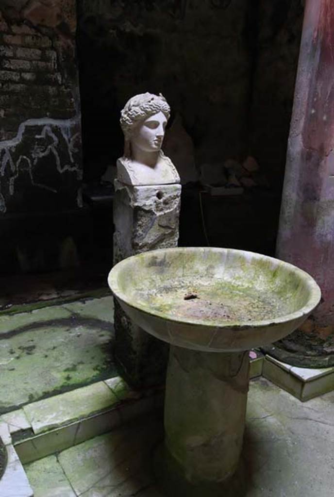 Suburban Baths, Herculaneum. June 2014. Atrium with fountain bust of Apollo.
Photo courtesy of Michael Binns. 
