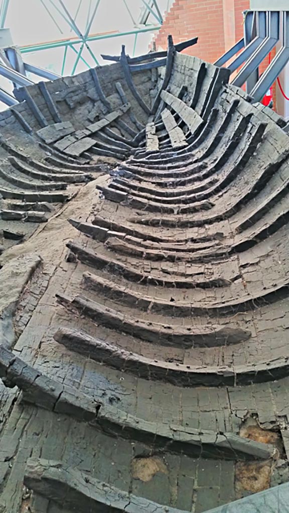Herculaneum, photo taken between October 2014 and November 2019.
Detail of carbonised wooden interior of boat. Photo courtesy of Giuseppe Ciaramella.

