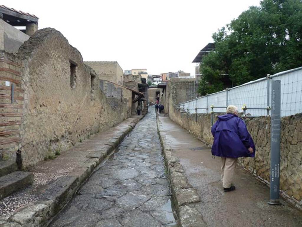 III.19/18/1, on left, Herculaneum, October 2014. Looking north along Cardo IV Inferiore. Photo courtesy of Michael Binns.
