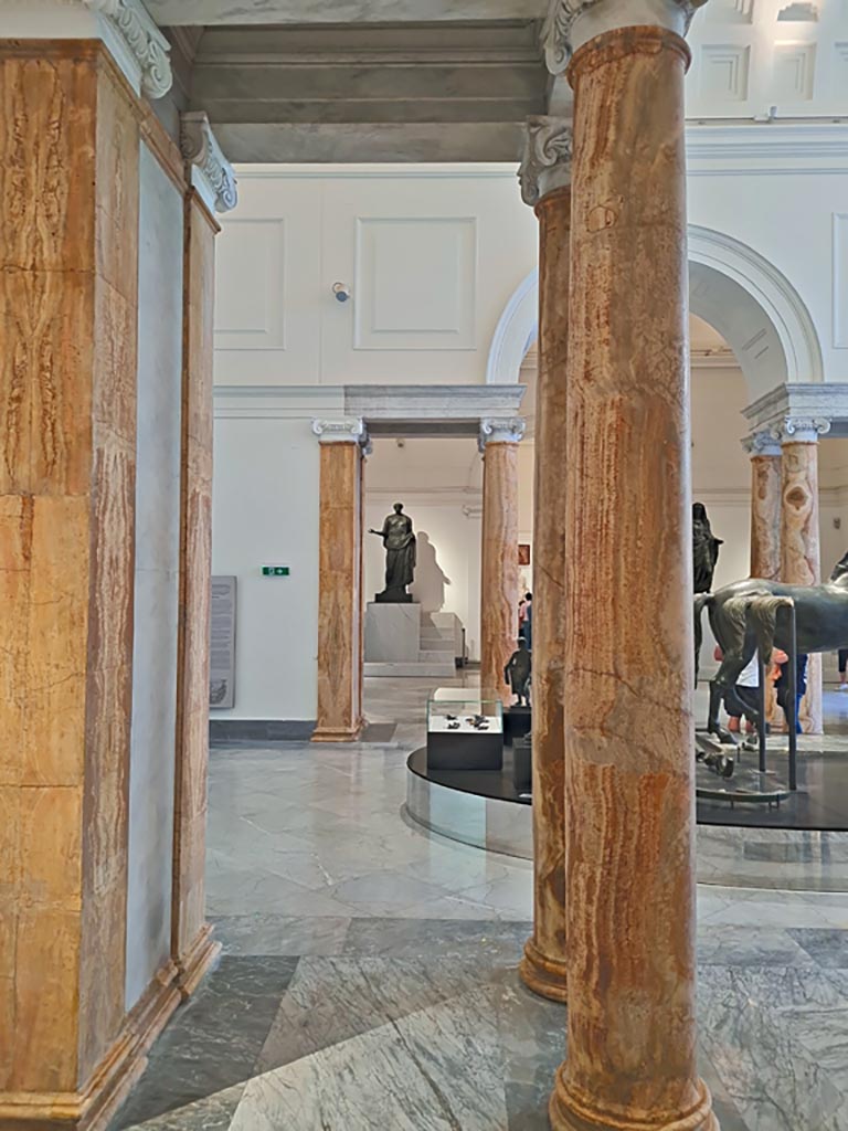 Naples Archaeological Museum, April 2023.
Detail of marble columns and pilasters, part of the “Campania Romana” gallery, looking towards the display of Bronze Horses.
Photo courtesy of Giuseppe Ciaramella.
