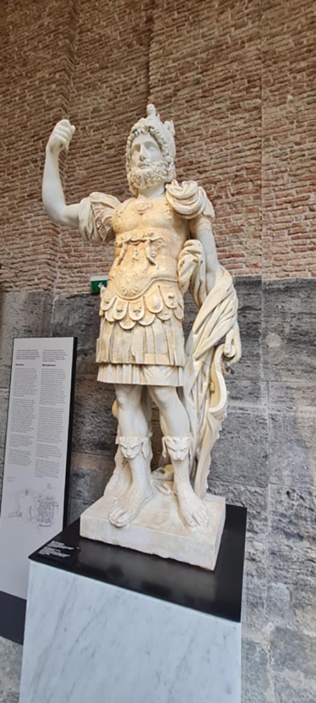 Herculaneum, public area. April 2023. 
White marble statue interpreted as Mars Ultor known as Pyrrhus (Mars the Avenger). 
On display in “Campania Romana” gallery of Naples Archaeological Museum, inv.6124.  
Photo courtesy of Giuseppe Ciaramella.
