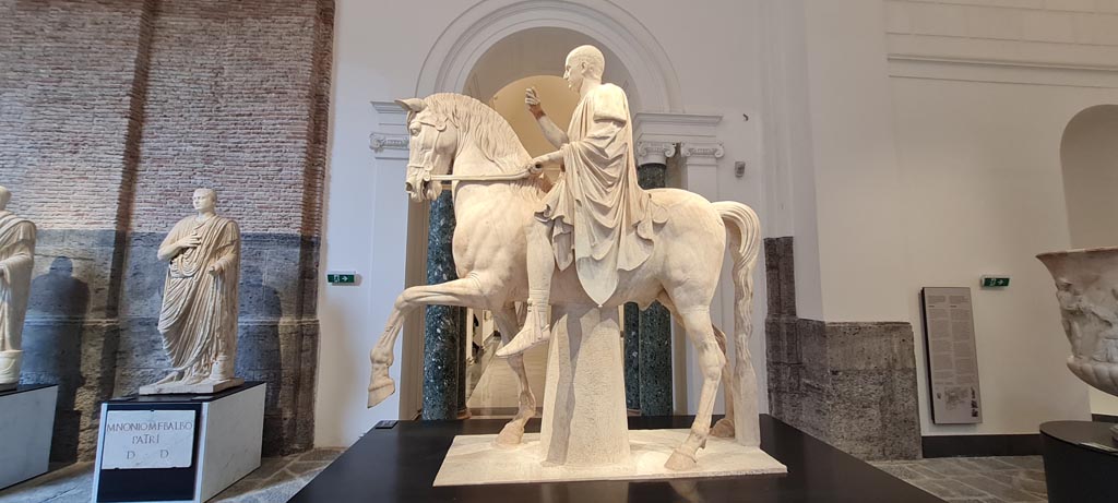 Herculaneum, public area. April 2023. 
Second white marble statue of Marcus Nonius Balbus, inv. 6211. 
On display in “Campania Romana” gallery of Naples Archaeological Museum. Photo courtesy of Giuseppe Ciaramella.
