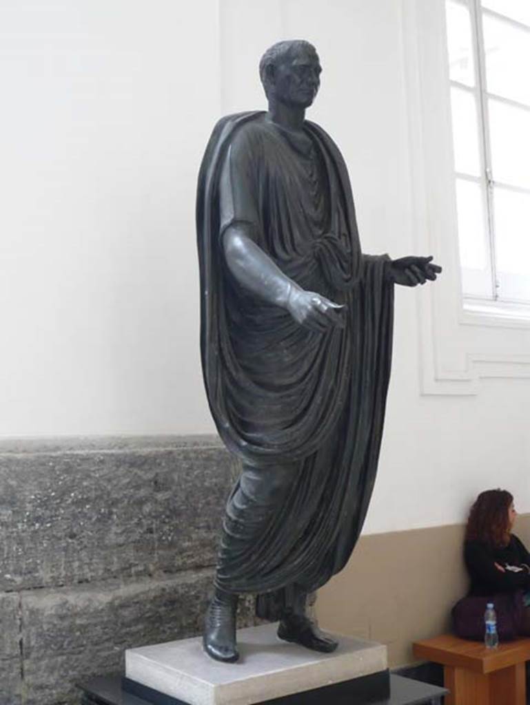 Herculaneum Theatre. May 2010. Statue of M. Calatorius Quarto. 
Now in Naples Archaeological Museum. Inventory number 5597.
Photo courtesy of Buzz Ferebee.
The inscription on the related plaque honouring Calatorius Quarto is recorded in CIL X 1447.
