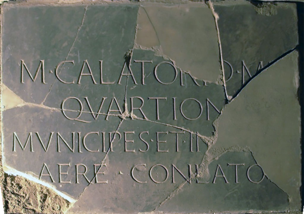 Herculaneum Theatre. Plaque relating to statue of M. Calatorius Quarto. 
The inscription honouring Calatorius Quarto is recorded in CIL X 1447.
M(arco) Calatorio M(arci) [f(ilio)]
Quartion[i]
municipes et in[colae]
aere conlato   [CIL X 1447]

According to Cooley and Cooley, this translates as 
To Marcus Calatorius Quarto, son of Marcus. The townsfolk and residents (set this up) by public subscription.
See Cooley, A. and M.G.L., 2014. Pompeii and Herculaneum: A Sourcebook. London: Routledge, D67b, p. 94.
Now in Naples Archaeological Museum. Inventory number 3730.
See plaque on EPIGRAPHIC DATABASE ROMA
