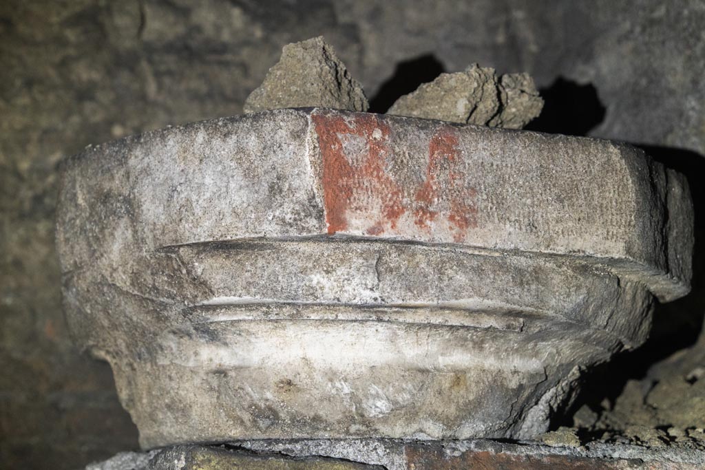 Herculaneum Theatre. October 2023. Column capital on brick wall at east end of proscenium.
Photo courtesy of Johannes Eber. 
