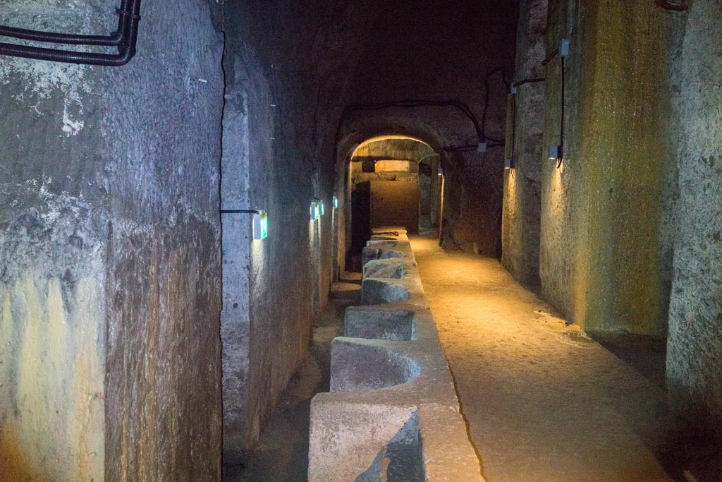 Herculaneum Theatre. October 2023. 
Looking across proscenium towards base with honorary inscription, at far end. Photo courtesy of Johannes Eber. 
