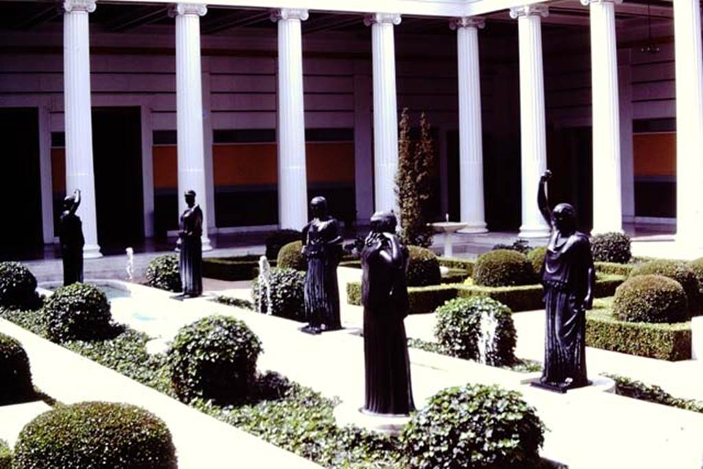 Getty Villa, Malibu, Spring 1982. Reproduction bronze figures of dancers  at edge of pool. Photo by Stanley A. Jashemski.   
Source: The Wilhelmina and Stanley A. Jashemski archive in the University of Maryland Library, Special Collections (See collection page) and made available under the Creative Commons Attribution-Non Commercial License v.4. See Licence and use details.
J80f0411
