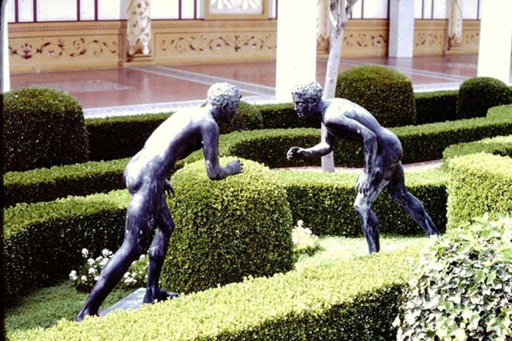 Getty Villa, Malibu, Spring 1982. Reproduction bronze statues of two wrestlers. Photo by Stanley A. Jashemski.   
Source: The Wilhelmina and Stanley A. Jashemski archive in the University of Maryland Library, Special Collections (See collection page) and made available under the Creative Commons Attribution-Non Commercial License v.4. See Licence and use details.
J80f0416
