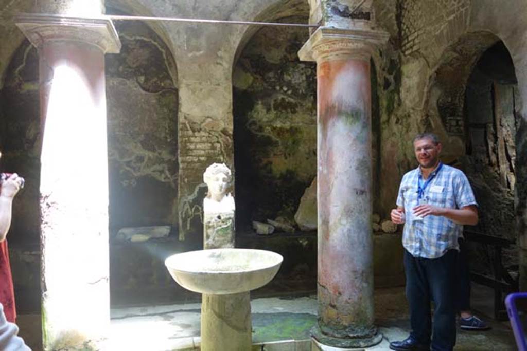 Fountain bust of Apollo, Suburban baths, Herculaneum. June 2014. Looking north across atrium with fountain bust of Apollo.
Photo courtesy of Michael Binns. 
