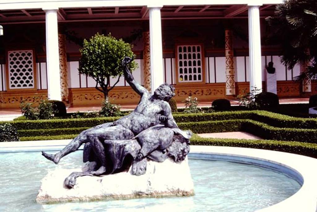 Getty Villa, Malibu, Spring 1982. Bronze statue of a drunken faun at end of pool in peristyle. Photo by Stanley A. Jashemski.   
Source: The Wilhelmina and Stanley A. Jashemski archive in the University of Maryland Library, Special Collections (See collection page) and made available under the Creative Commons Attribution-Non Commercial License v.4. See Licence and use details.
J80f0423

