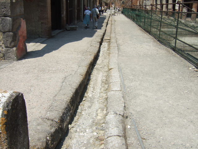 Looking north on Cardo IV, with junction of Decumanus Maximus, Herculaneum. May 2010.