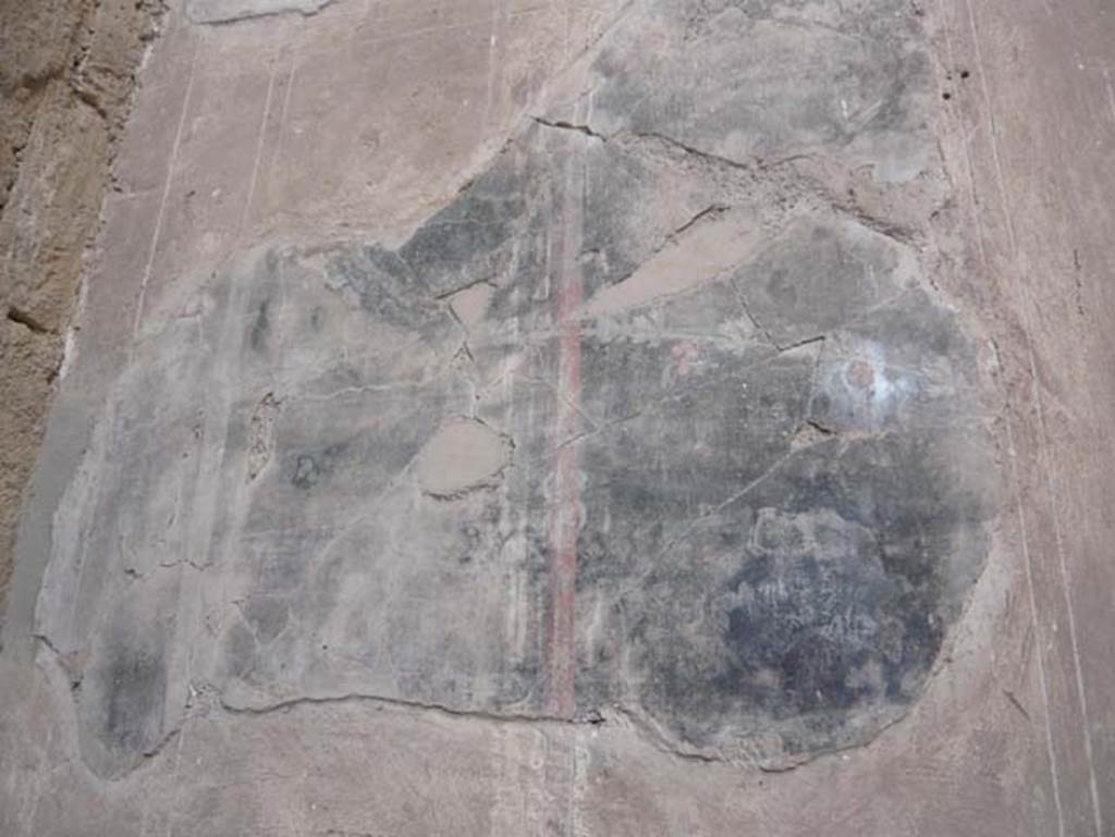 V.1 Herculaneum. August 2013. West wall of atrium, painted decoration from south side of doorway to room 3. Photo courtesy of Buzz Ferebee.