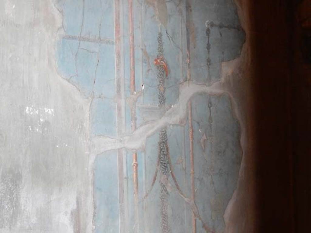 V.1, Herculaneum. May 2018. Room 7, detail of painted decoration on north wall. Photo courtesy of Buzz Ferebee.